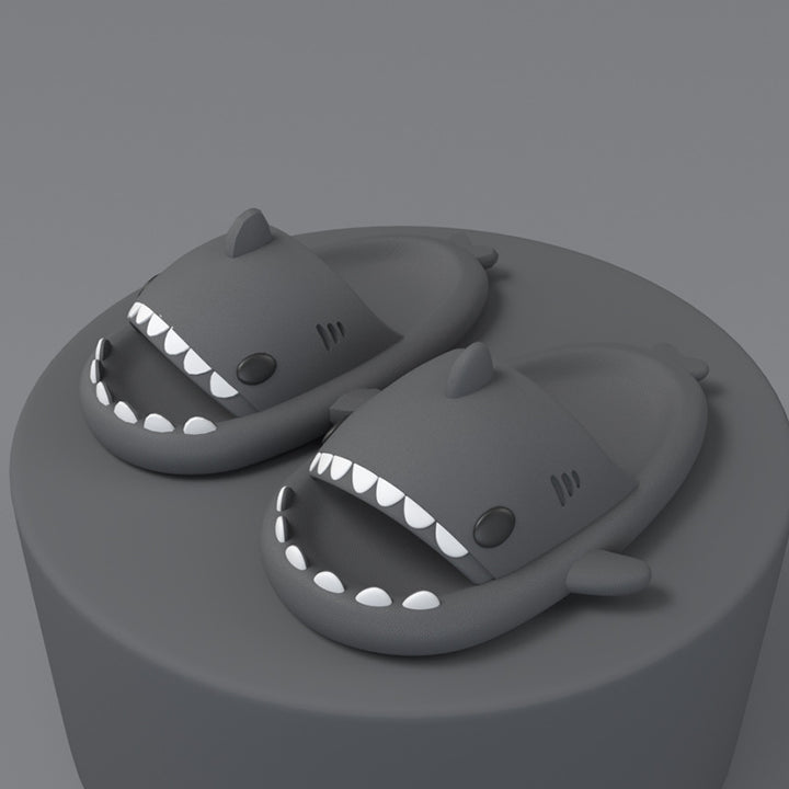 Pink cartoon shark slides on feet